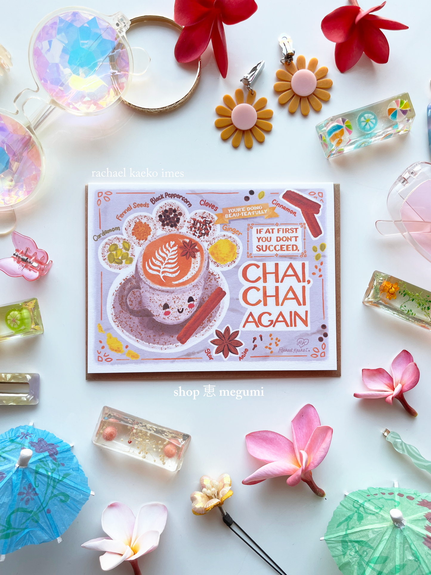 Cute chai latte greeting card with 'Chai, Chai Again' design surrounded by decorative items on a white background