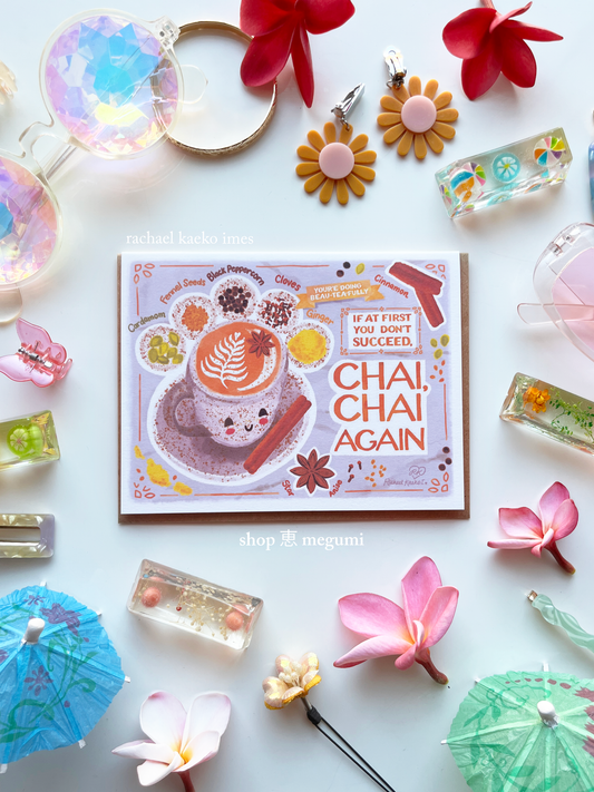 Cute chai latte greeting card with 'Chai, Chai Again' design surrounded by decorative items on a white background