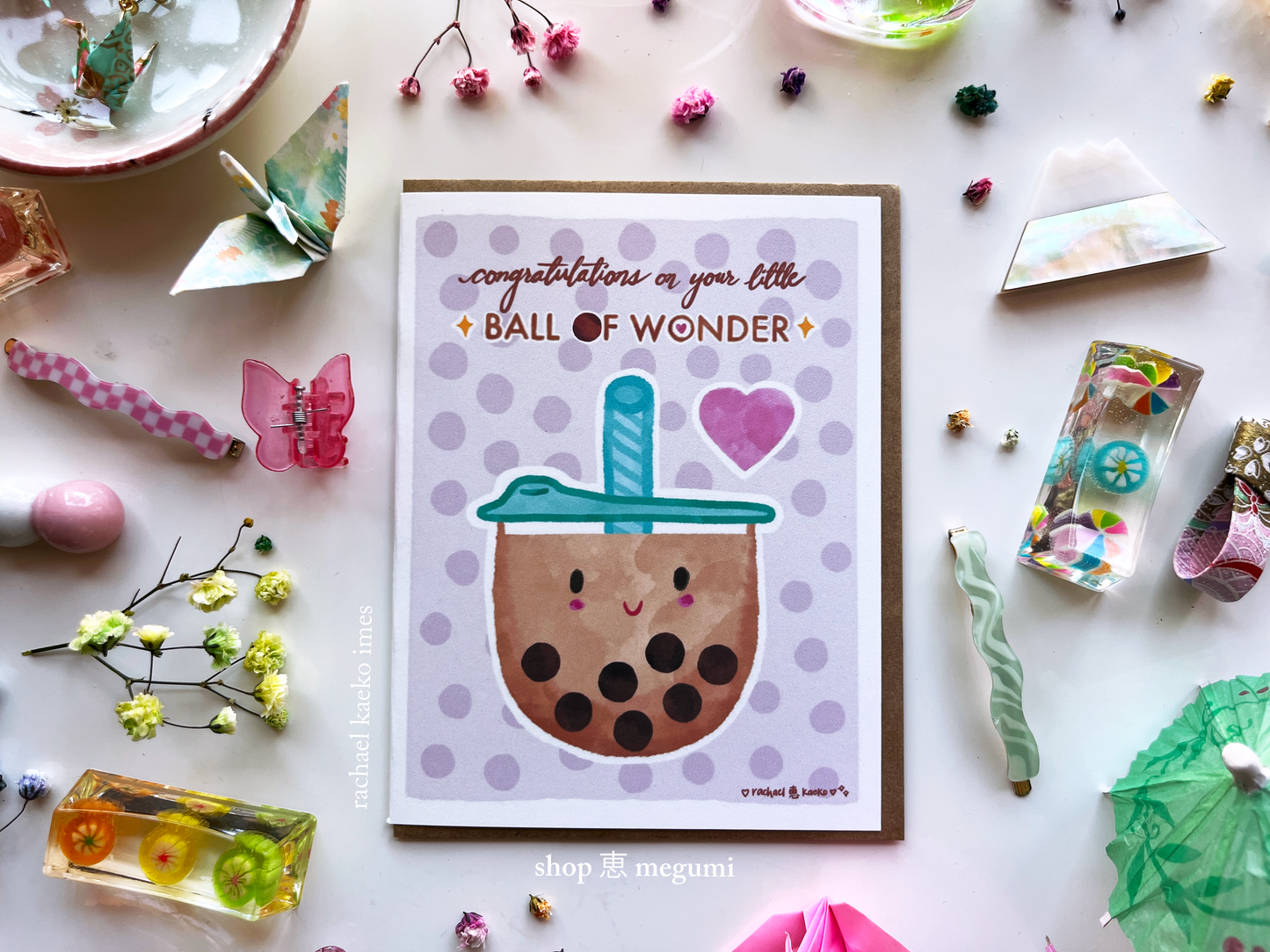 Baby shower congratulations greeting card with a bubble tea design and text on a decorative background.