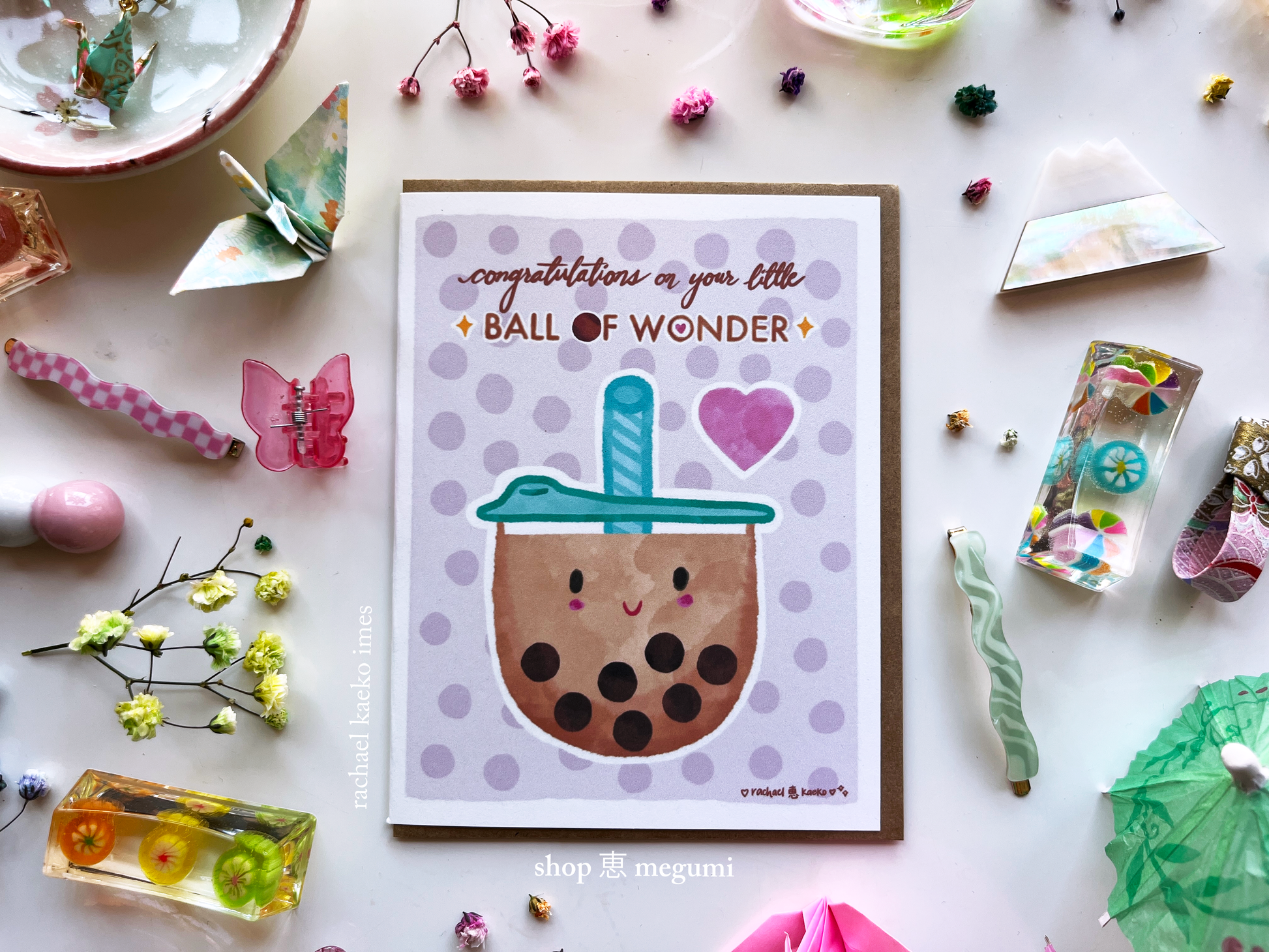 Baby shower congratulations greeting card with a bubble tea design and text on a decorative background.